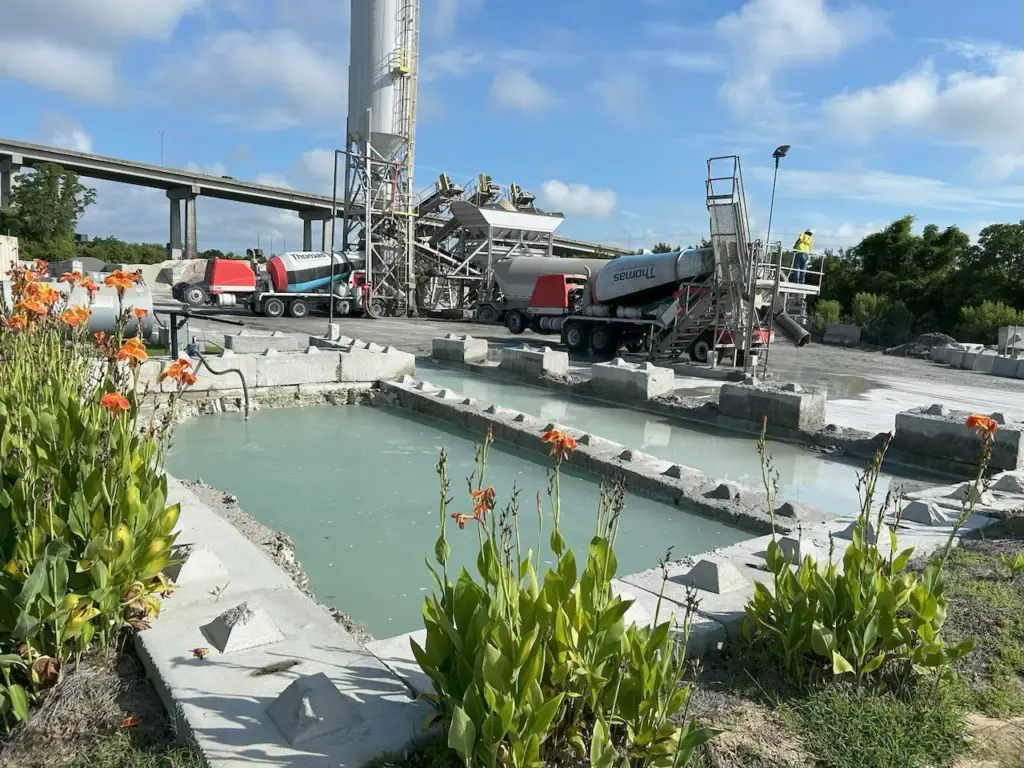 Retention pond in front of concrete plant