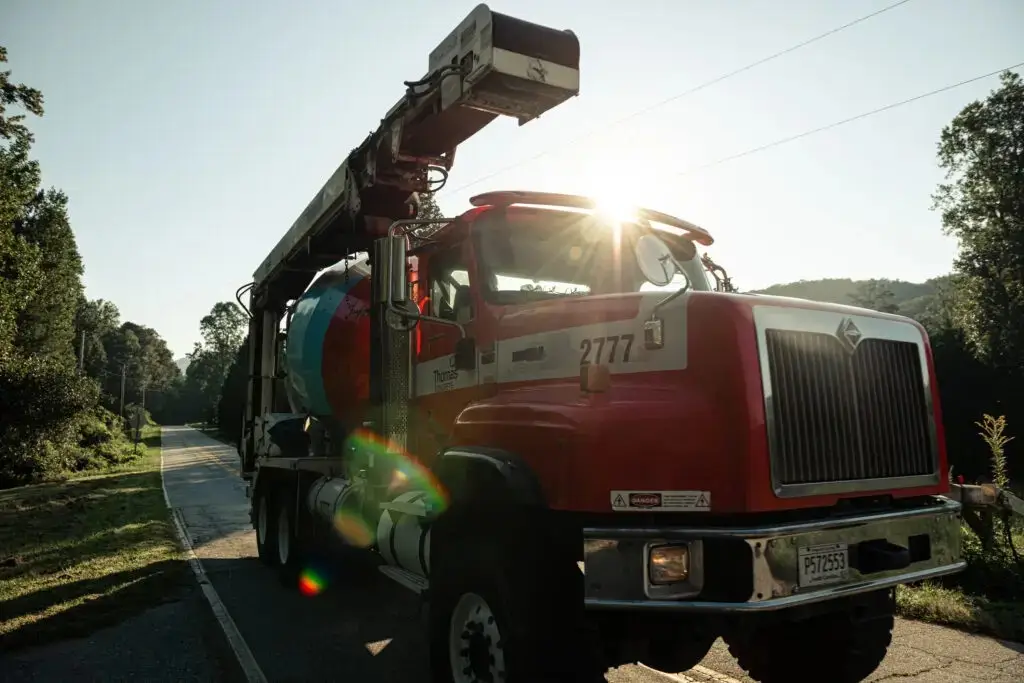 Closeup of conveyor truck with sunlight reflecting off the cab